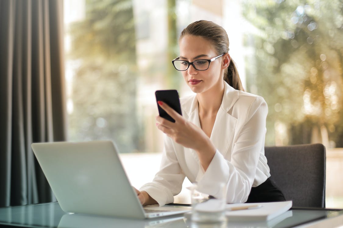 Photo Of Person Using Smartphone