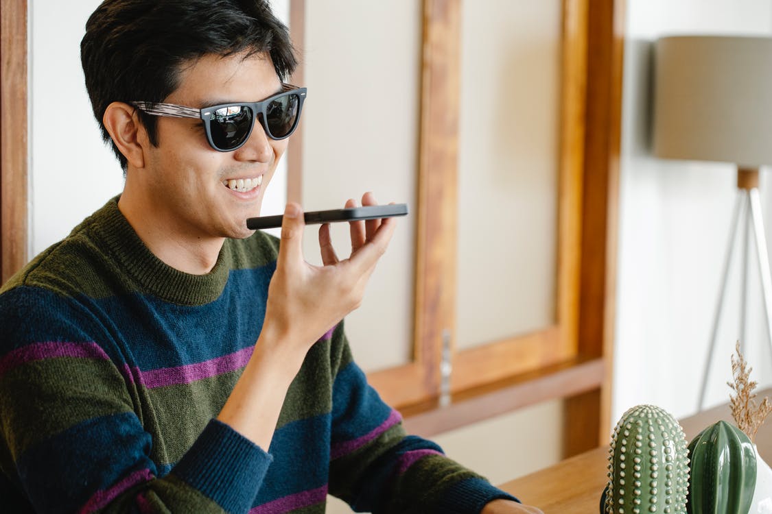 Photo of Man in Casual Oufit Talking to the Phone