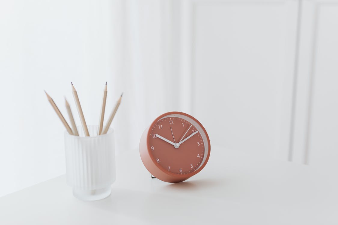 White Round Analog Wall Clock at 10 10